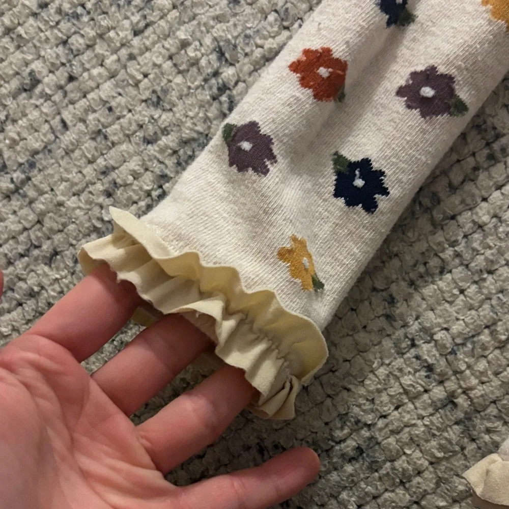 Ruffle Butts Cream Tights with Colorful Floral Pattern